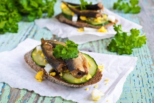 Sandwiches with sprats and fresh cucumber are a simple and delicious recipe for how to cook step by step