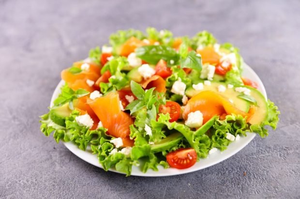 Fresh salad with smoked red fish, avocado and feta cheese is a simple and delicious recipe how to cook step by step