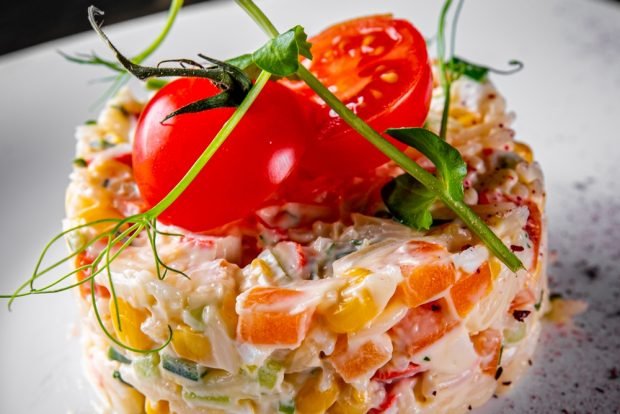 Crab salad with carrots and cherry