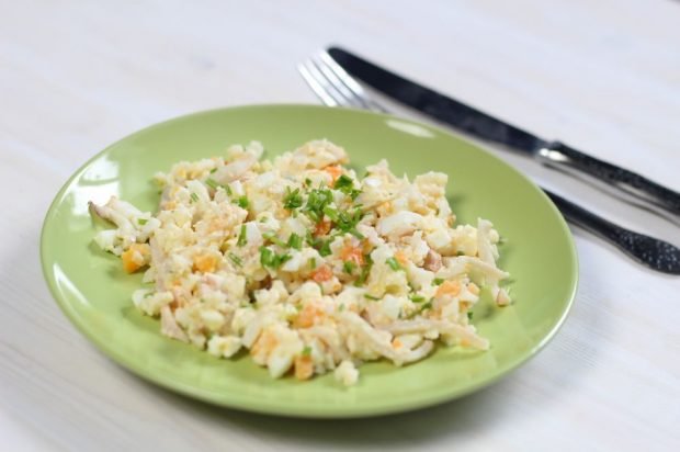 A hearty salad with squid, rice, eggs and carrots is a simple and delicious recipe, how to cook step by step