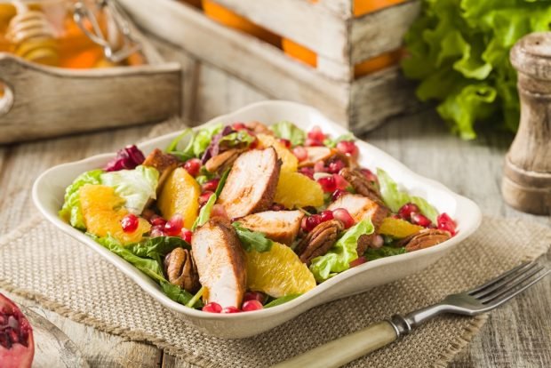 Salad with chicken, pomegranate, nuts and honey dressing is a simple and delicious recipe, how to cook step by step