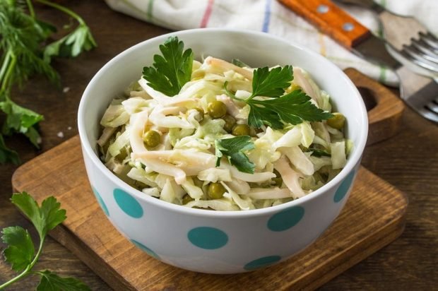 Salad of squid, cabbage, cucumbers and green peas