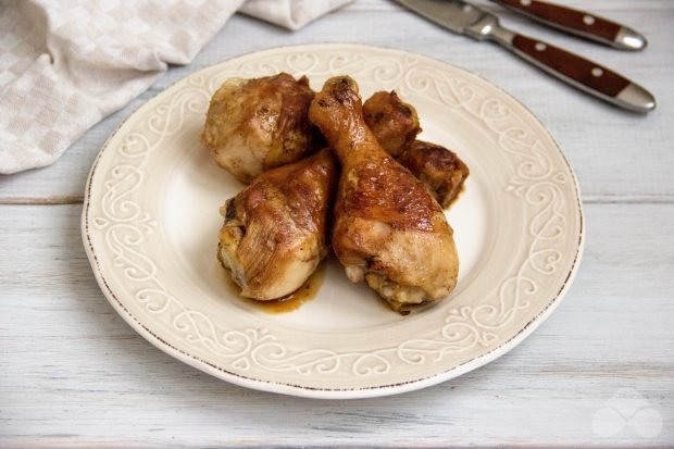 Chicken legs in soy sauce in a frying pan