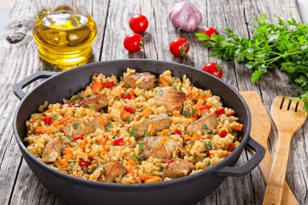 Paella with chicken and vegetables is a simple and delicious recipe how to cook step by step