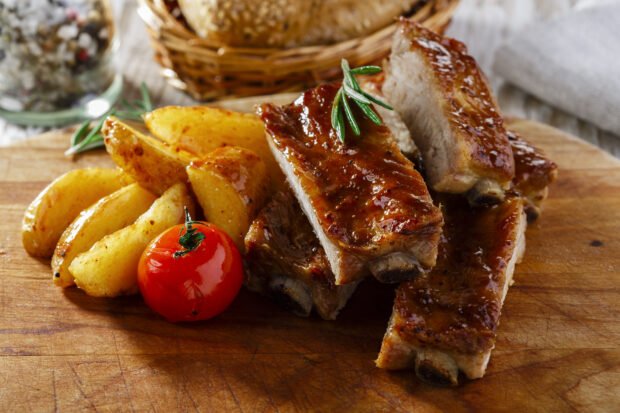 Pork ribs with potatoes and tomatoes in the oven – a simple and delicious recipe how to cook step by step