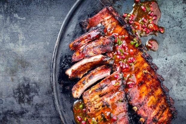 Fried pork ribs in a frying pan