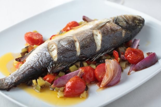 Sea bass with vegetables in the oven