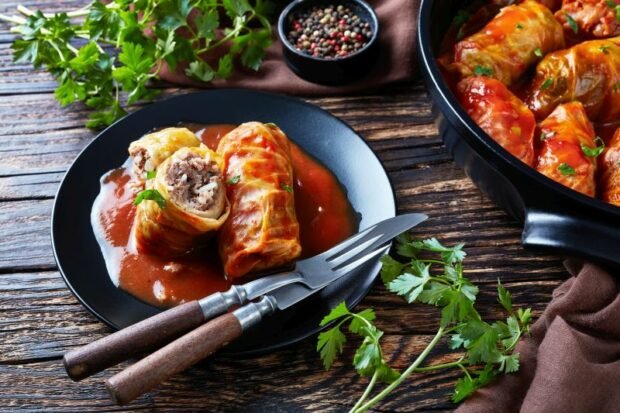 Stuffed cabbage rolls with minced pork in the oven