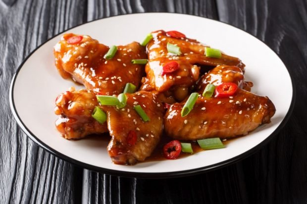 Chicken wings baked in sweet and sour sauce is a simple and delicious recipe how to cook step by step