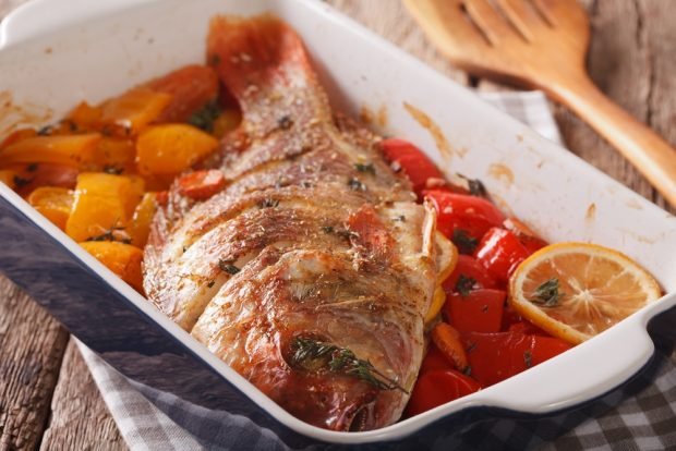 Whole tilapia with vegetables in the oven is a simple and delicious recipe for how to cook step by step