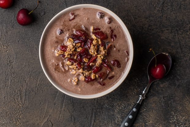 Oatmeal porridge with cherries and chocolate 