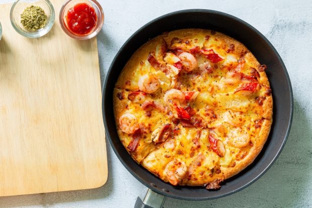 Shrimp pizza in a frying pan is a simple and delicious recipe how to cook step by step