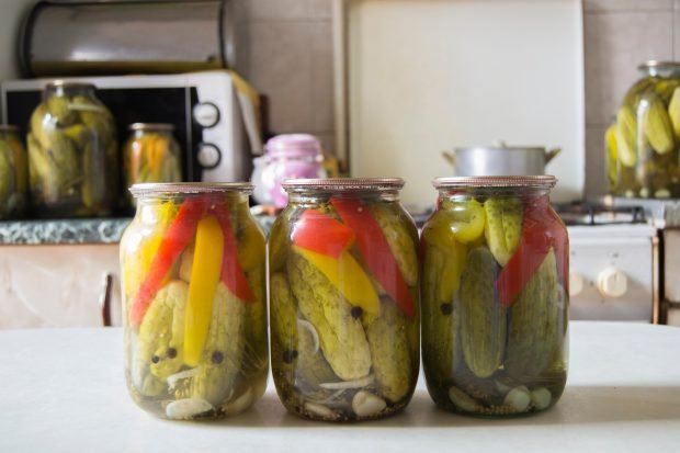 Cucumbers with pepper for winter in jars